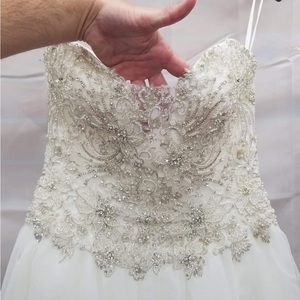 Beautiful wedding dress. Size 12. No flaws. Not worn. Regular $1500.